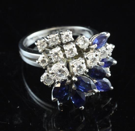 An 18ct white gold sapphire and diamond cluster dress ring, size N.